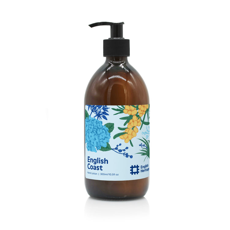 An English Heritage English Coast scented hand and body lotion in clear glass bottle with black lotion pump