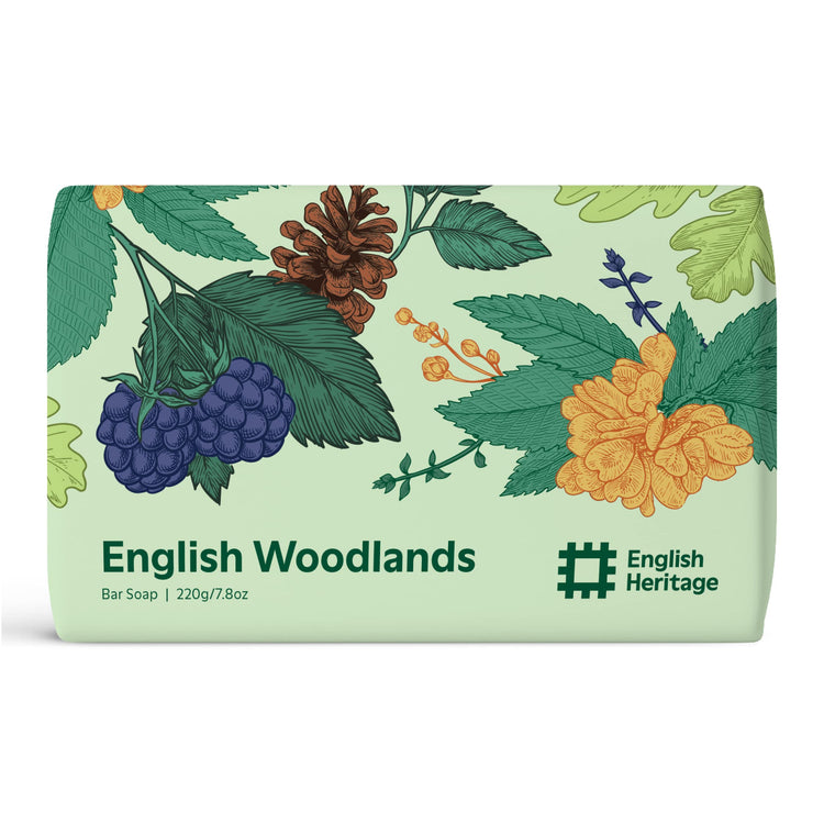 An English Heritage English Woodlands scented soap bar is shown in its woodland illustrated eco-friendly soap wrap