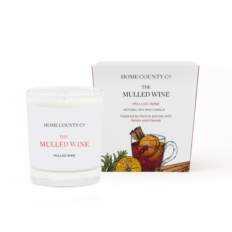 A Mulled Wine votive Christmas candle from the Home County Co. is shown in eco-friendly packaging