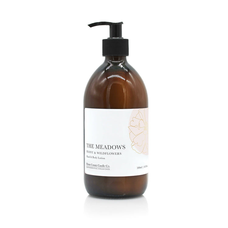 A 500ml floral peony and wildflowers scented hand and body lotion from the Home County Co. is shown in its eco-friendly amber glass bottle