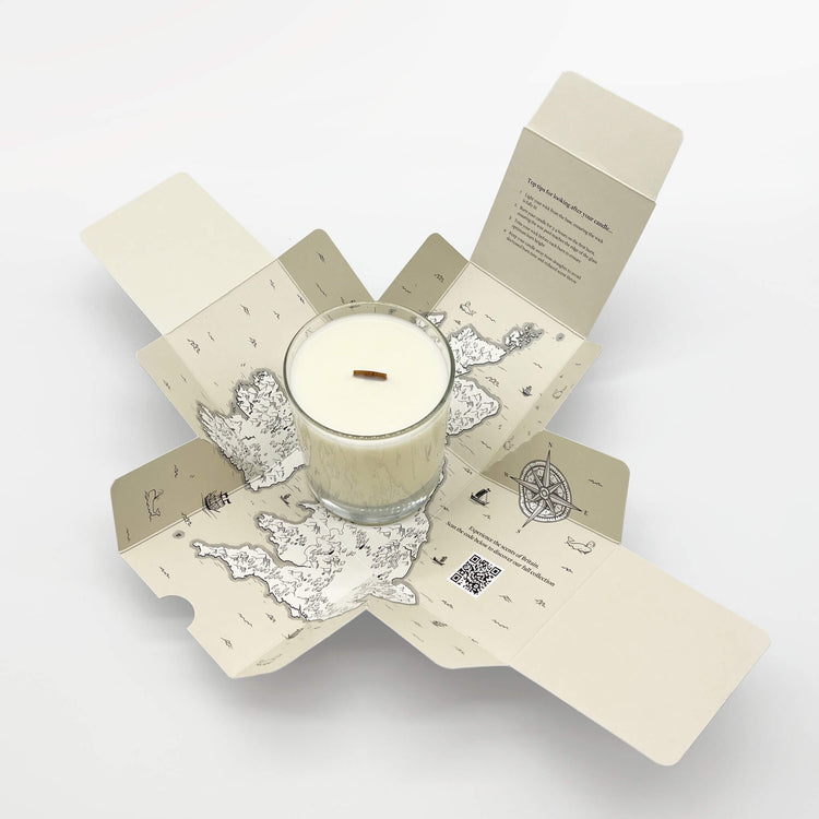 An open eco-friendly candle box from the Home County Co. reveals a map of the UK inside.