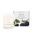 A damson and bramble scented candle from Home County Co. The cotton wick soy candle is shown next to the eco friendly candle box packaging.